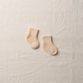 White organic cotton yak pile socks for newborns by Yahae, soft and cozy baby accessories with a gentle, plush texture.